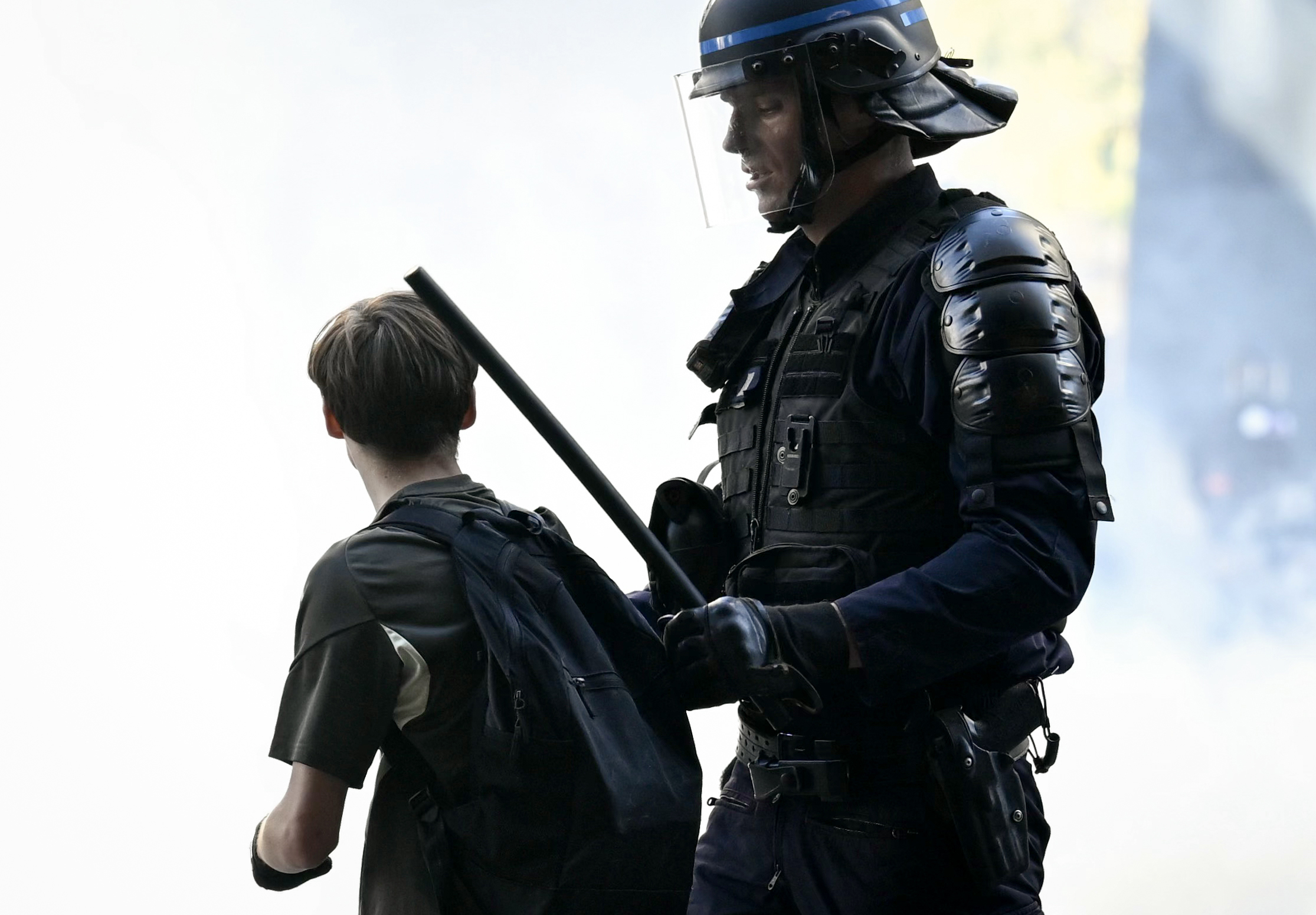 Teenager loses hand picking up grenade in France school protests